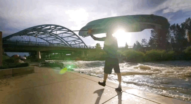 Man with kayak at Confluence Park in Denver, Colorado Man with kayak at Confluence Park in Denver, Colorado