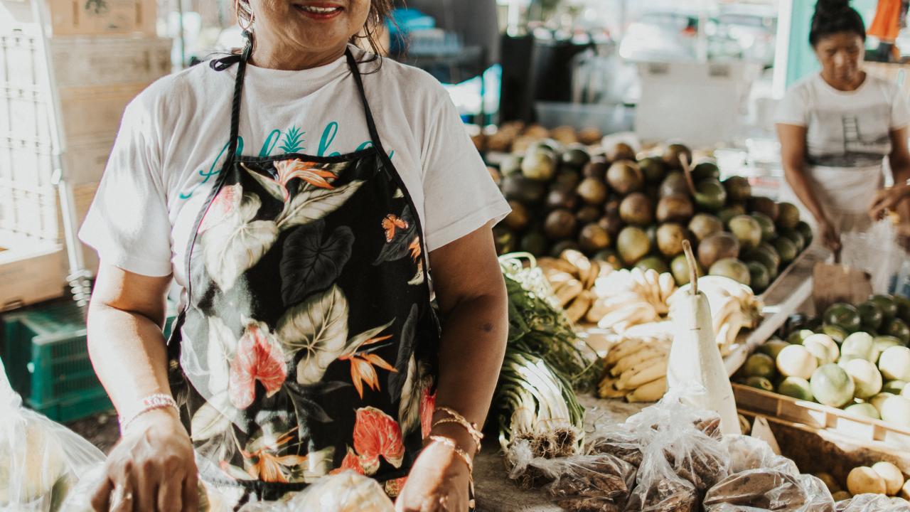 Local vendor at a produce market in Hawai'i Local vendor at a produce market in Hawai'i