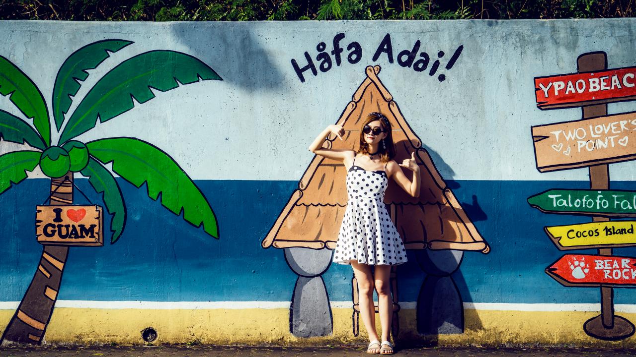 Posing with public mural art in Guam Posing with public mural art in Guam