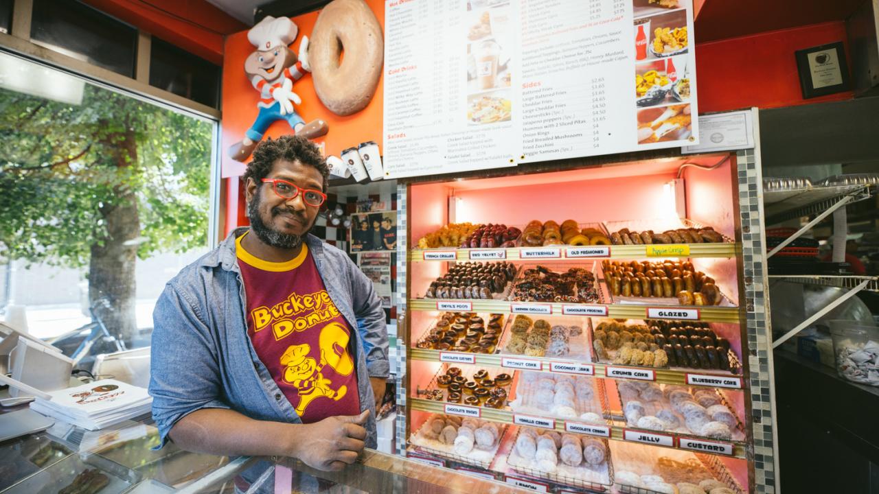 An employee at Buckeye Donuts in Columbus, Ohio An employee at Buckeye Donuts in Columbus, Ohio