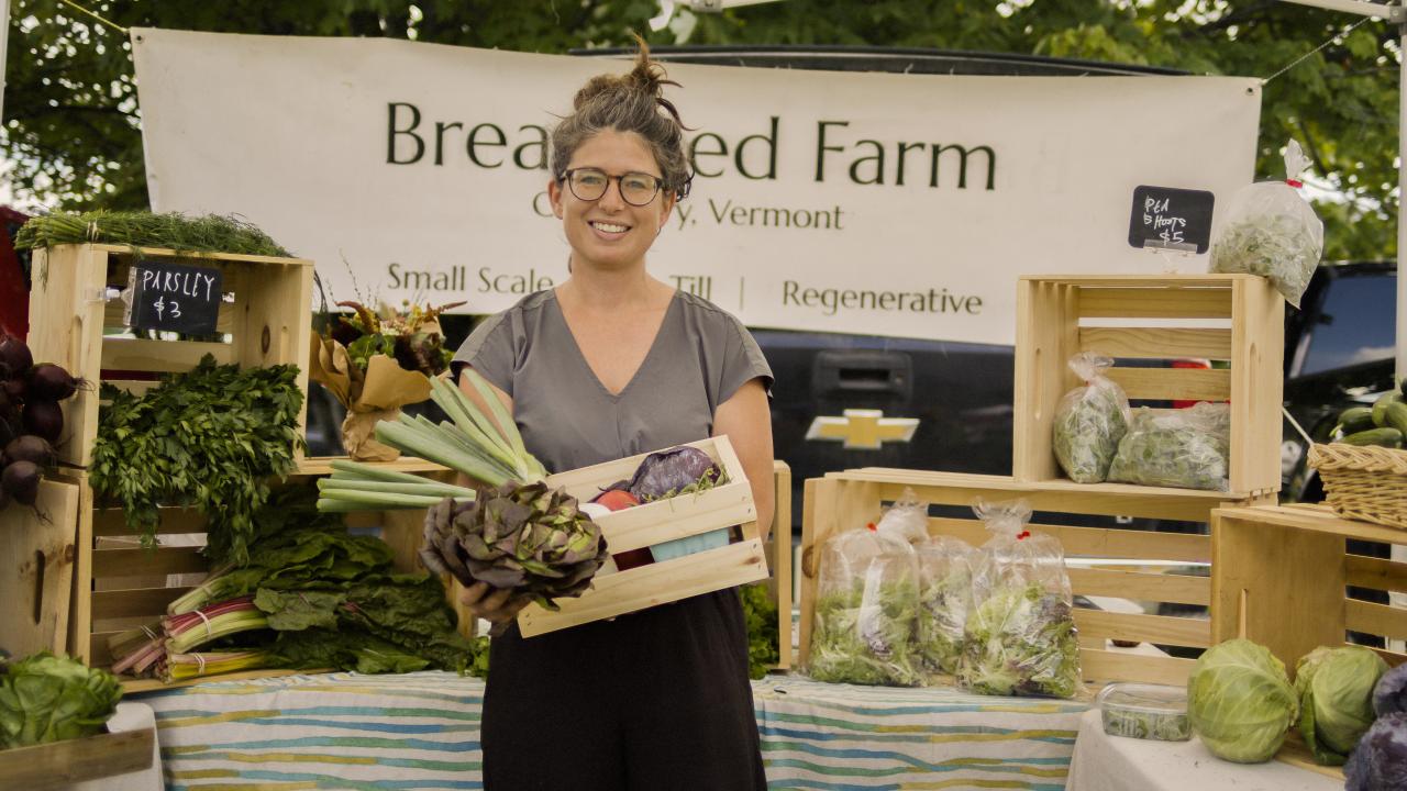 Showing off farm-fresh produce in Stowe, Vermont Showing off farm-fresh produce in Stowe, Vermont