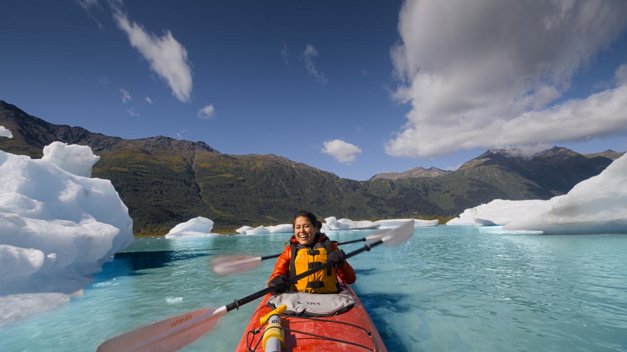 Kayaking through the arctic blue waters of Spencer Glacier in Chugach National Forest Kayaking through the arctic blue waters of Spencer Glacier in Chugach National Forest