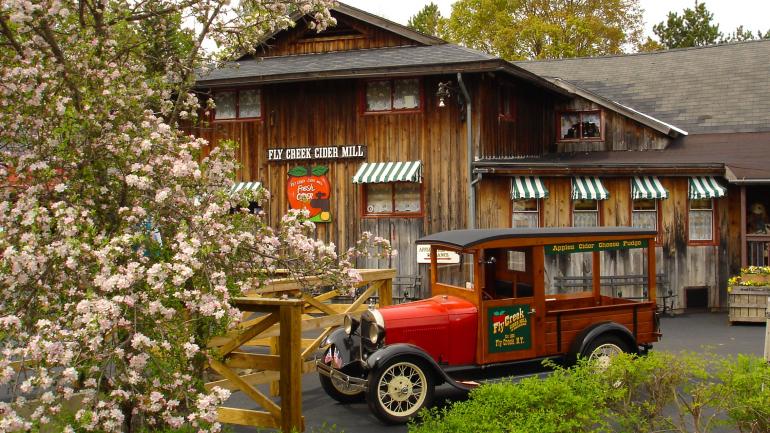 Antique car in front of Fly Creek Cider Mill and Orchard in New York Antique car in front of Fly Creek Cider Mill and Orchard in New York
