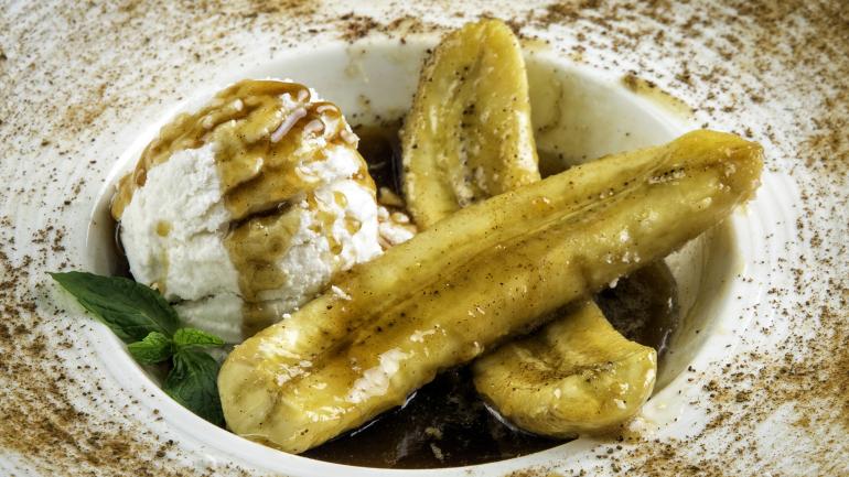 Bananas Foster, a flambéed dessert of bananas spiked with rum, is one of the iconic Louisiana recipes you’ll encounter on the Creole Crescent Trail. Bananas Foster, a flambéed dessert of bananas spiked with rum, is one of the iconic Louisiana recipes you’ll encounter on the Creole Crescent Trail.