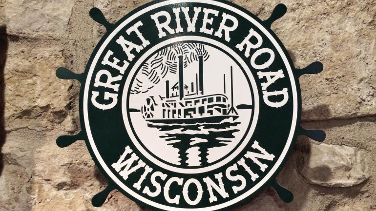 Great River Road Ship's Wheel Sign in Potosi, Wisconsin Great River Road Ship's Wheel Sign in Potosi, Wisconsin