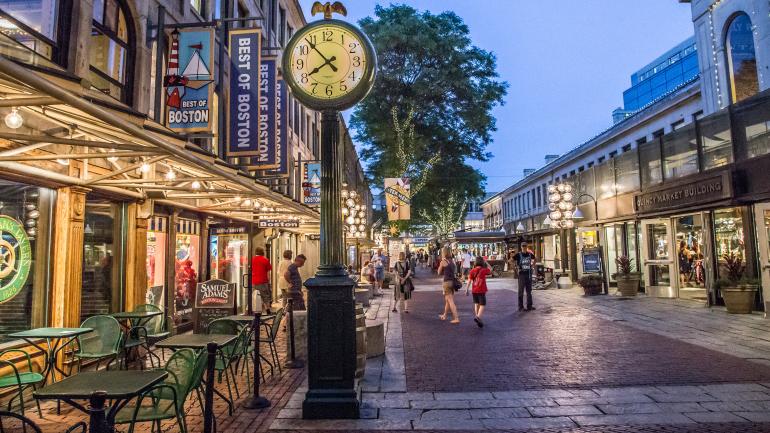 Walking through Quincy Market in Boston, Massachussets Walking through Quincy Market in Boston, Massachussets