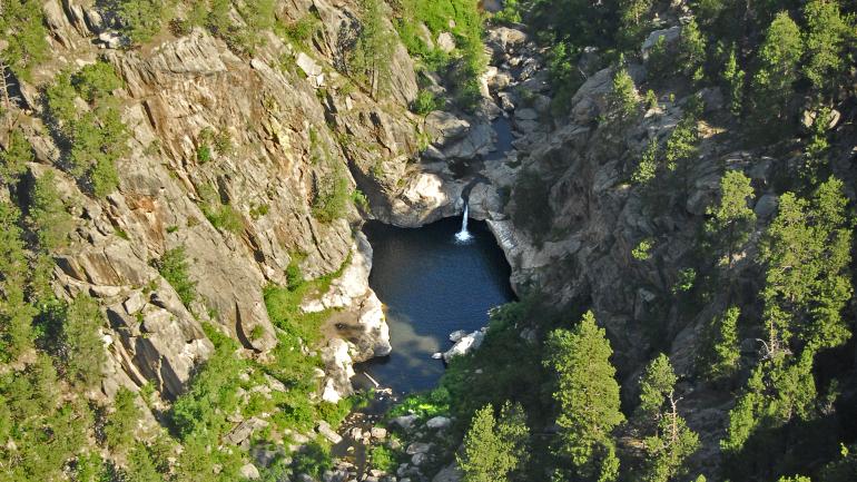 Two routes – one easier, one more strenuous – lead hikers to the refreshing waters of Hippie Hole. Two routes – one easier, one more strenuous – lead hikers to the refreshing waters of Hippie Hole.