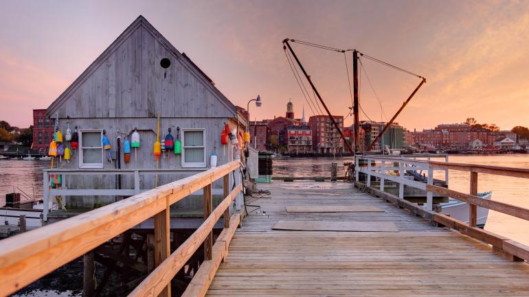Sunset over a fishing pier along the Piscataqua River in Kittery, Maine Sunset over a fishing pier along the Piscataqua River in Kittery, Maine