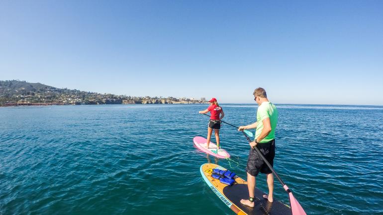 Stand-up paddleboarding in La Jolla, California Stand-up paddleboarding in La Jolla, California
