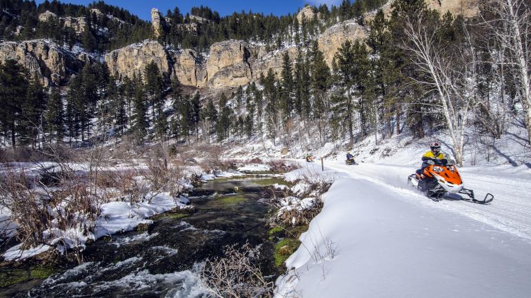 Snowmobilers enjoy the powdery roads and trails in Spearfish Canyon near Roughlock Falls. Snowmobilers enjoy the powdery roads and trails in Spearfish Canyon near Roughlock Falls.