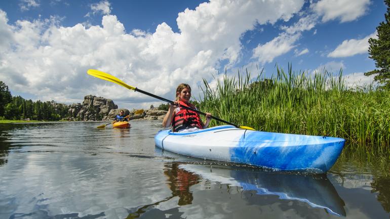 Kayakers enjoy the calm waters of Custer State Park’s Sylvan Lake. Kayakers enjoy the calm waters of Custer State Park’s Sylvan Lake.