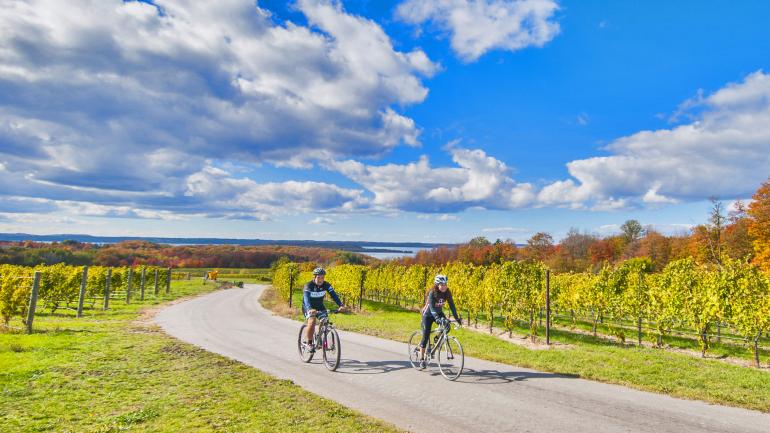 Tour Traverse City’s wine country via bike trails, which pass right alongside the vines. Tour Traverse City’s wine country via bike trails, which pass right alongside the vines.