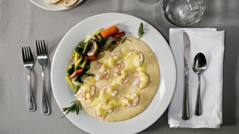 Shrimp and grits, a South Carolina staple in coastal communities like Beaufort Shrimp and grits, a South Carolina staple in coastal communities like Beaufort