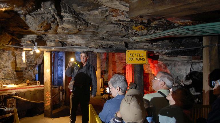 Veteran miner leading an underground tour at the Beckley Exhibition Coal Mine in West Virginia Veteran miner leading an underground tour at the Beckley Exhibition Coal Mine in West Virginia