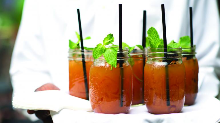 Craft cocktails, garnished with sprigs of fresh mint and berries, are served before, during and after meals. Craft cocktails, garnished with sprigs of fresh mint and berries, are served before, during and after meals.