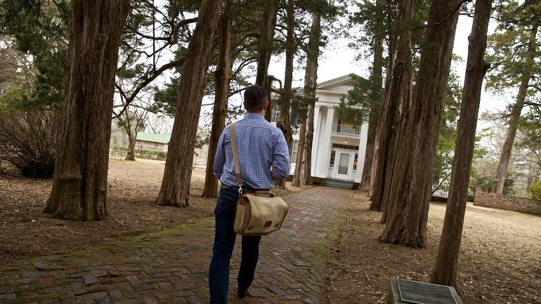 Strolling the walkway leading to Rowan Oak, the Oxford, Mississippi, home of the late author William Faulkner Strolling the walkway leading to Rowan Oak, the Oxford, Mississippi, home of the late author William Faulkner