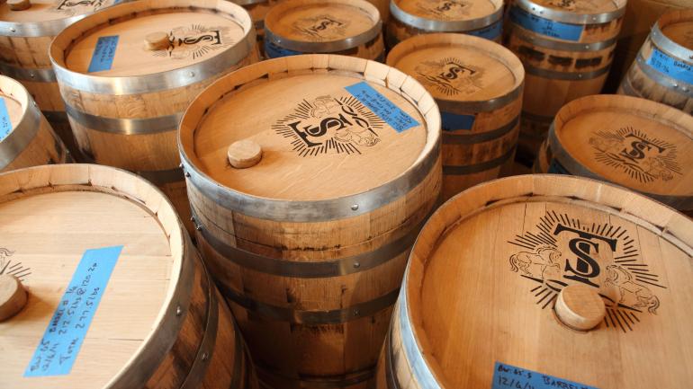 Awaiting bottling, barrels full of Troy & Sons’ moonshine, or “white whiskey,” at Asheville Distilling Co. in Asheville, North Carolina Awaiting bottling, barrels full of Troy & Sons’ moonshine, or “white whiskey,” at Asheville Distilling Co. in Asheville, North Carolina