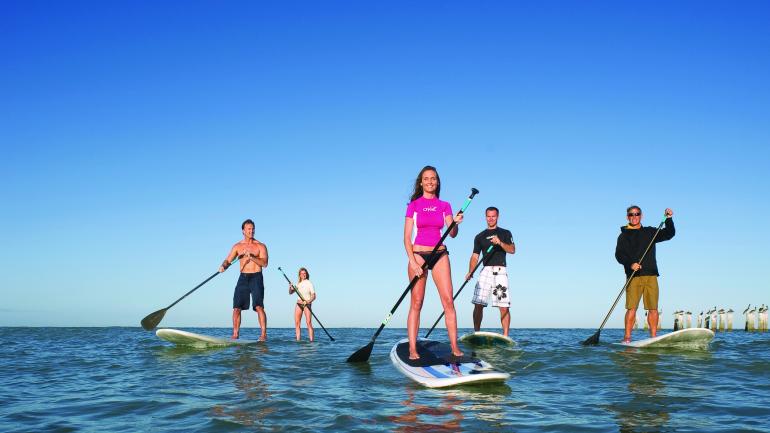 Rent a stand-up paddleboard (SUP) and ride the shallow waters of Clam Pass Beach. Rent a stand-up paddleboard (SUP) and ride the shallow waters of Clam Pass Beach.