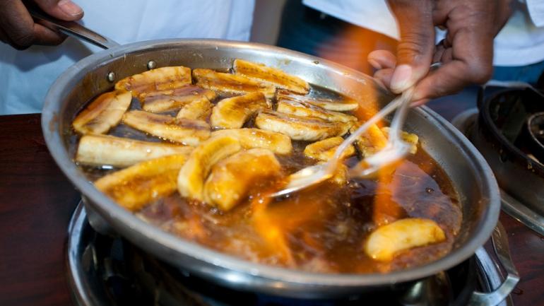 Indulge in Bananas Foster at finer restaurants around New Orleans for a decadent combination of flambéed bananas, cinnamon and rum served over ice cream. Indulge in Bananas Foster at finer restaurants around New Orleans for a decadent combination of flambéed bananas, cinnamon and rum served over ice cream.