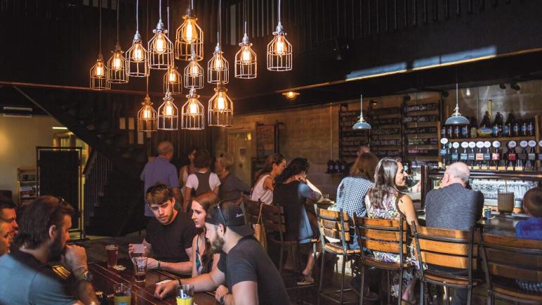 Relax on the intimate bar side of 3 Daughters Brewing, or wander into the brewery’s warehouse space for games and live music. Relax on the intimate bar side of 3 Daughters Brewing, or wander into the brewery’s warehouse space for games and live music.