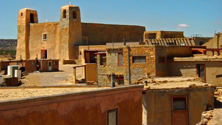 The Acoma Pueblo is perched high above the desert. The Acoma Pueblo is perched high above the desert.