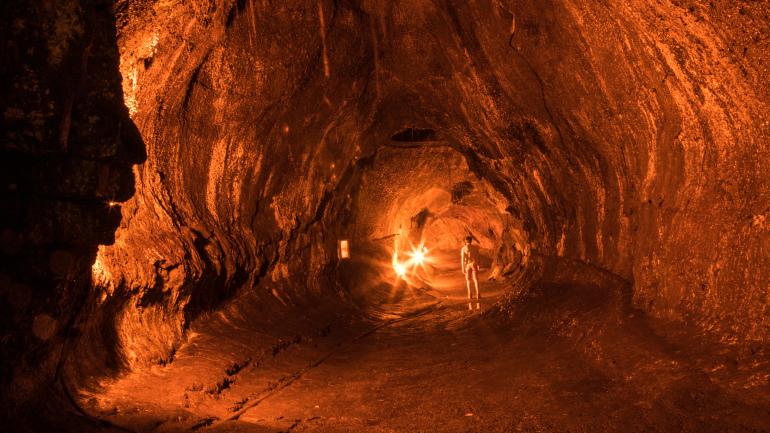 Walking through lighted lava tubes at Hawaiʻi Volcanoes National Park Walking through lighted lava tubes at Hawaiʻi Volcanoes National Park