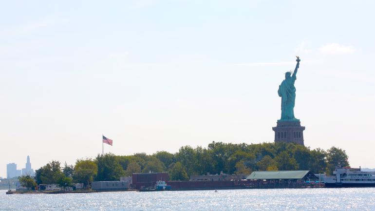 View of the Statue of Liberty from the Liberty State Park boardwalk in Jersey City, Hudson County. View of the Statue of Liberty from the Liberty State Park boardwalk in Jersey City, Hudson County.