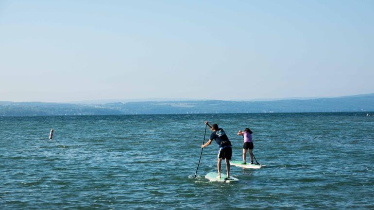 Paddle-boarding on Canandaigua Lake, New York.c Paddle-boarding on Canandaigua Lake, New York.c