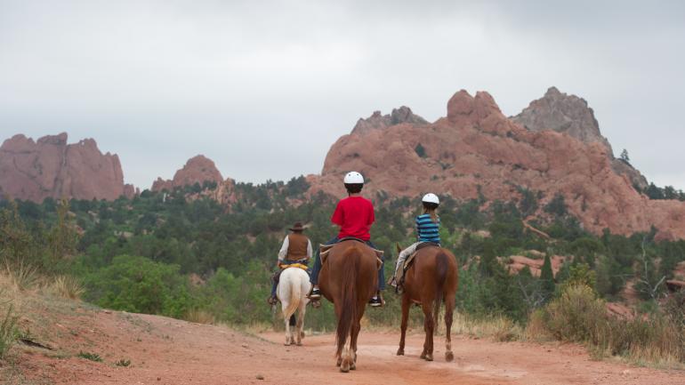 Horseback riding through Garden of the Gods is a uniquely Western way to see its iconic formations. Horseback riding through Garden of the Gods is a uniquely Western way to see its iconic formations.