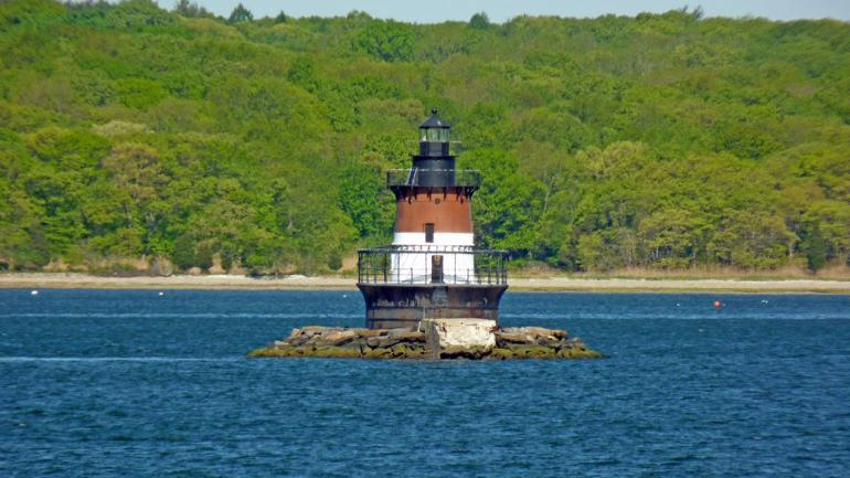 You’ll spot the Plum Beach Lighthouse as you head across the Jamestown Verrazzano Bridge, which connects the town of Jamestown to the western coast of the Narragansett Bay. You’ll spot the Plum Beach Lighthouse as you head across the Jamestown Verrazzano Bridge, which connects the town of Jamestown to the western coast of the Narragansett Bay.