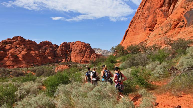 Hikers in Snow Canyon State Park, Utah Hikers in Snow Canyon State Park, Utah