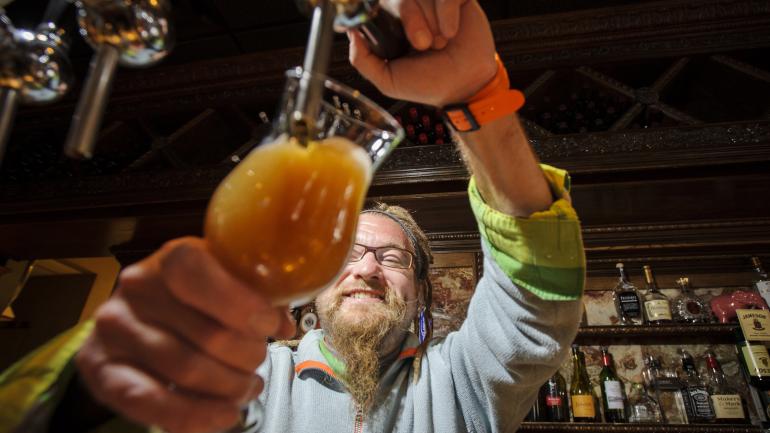 Pouring a beer for thirsty customers in Central New York Pouring a beer for thirsty customers in Central New York