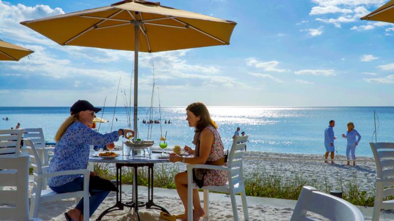 Food on the table, toes in the sand at The Turtle Club Food on the table, toes in the sand at The Turtle Club