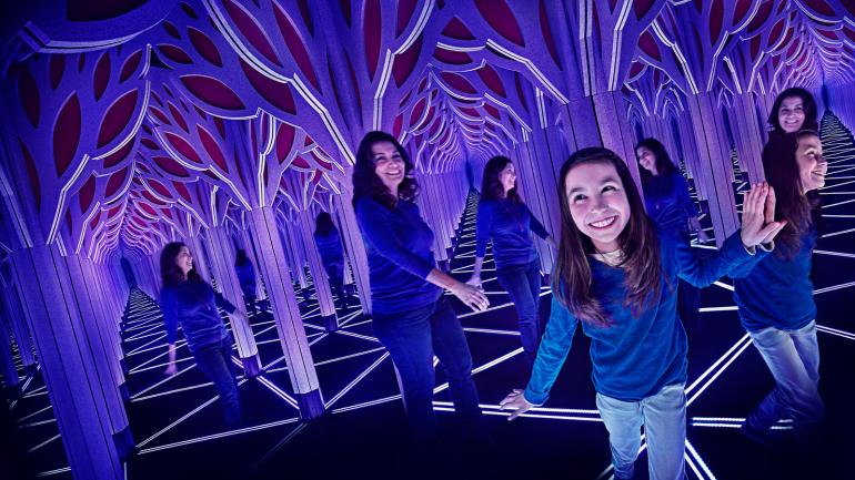 Visitors making their way through the mirror maze at the Museum of Science and Industry Visitors making their way through the mirror maze at the Museum of Science and Industry