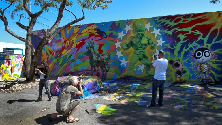 Snap photos of the vibrant colors and unique designs featured at Wynwood Walls Snap photos of the vibrant colors and unique designs featured at Wynwood Walls
