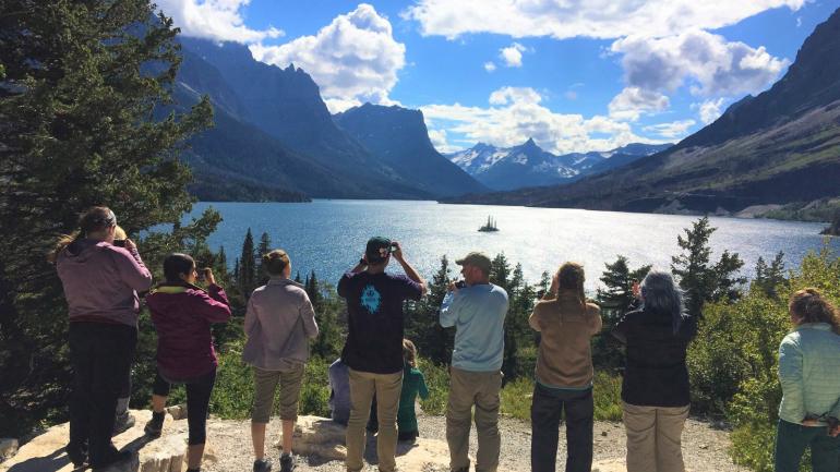 A tour group soaking up the views along Going-to-the-Sun Road A tour group soaking up the views along Going-to-the-Sun Road