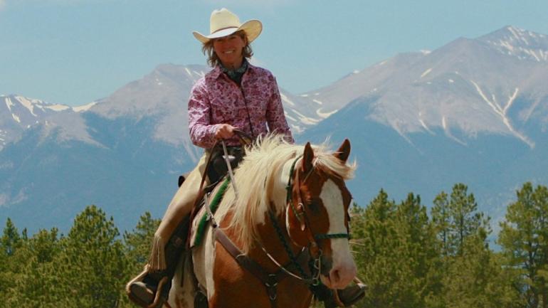 Riding against a backdrop of stunning Colorado mountains Riding against a backdrop of stunning Colorado mountains