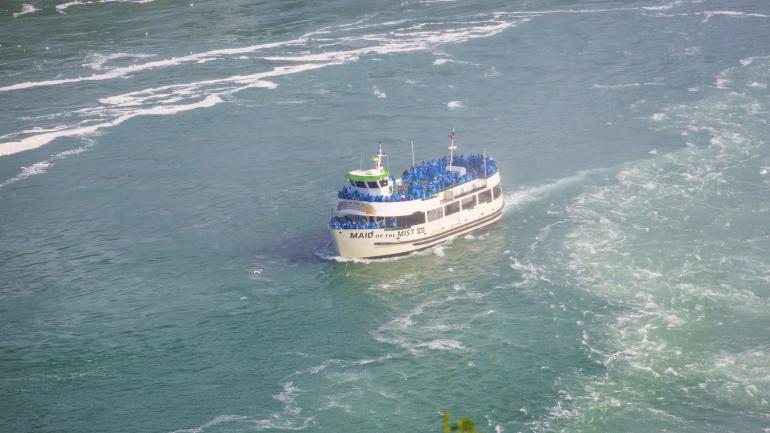 Maid of the Mist boat tour approaching Niagara Falls Maid of the Mist boat tour approaching Niagara Falls