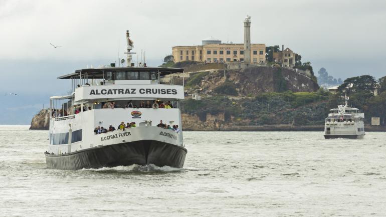 Visitors enjoying a scenic ride with Alcatraz Cruises Visitors enjoying a scenic ride with Alcatraz Cruises