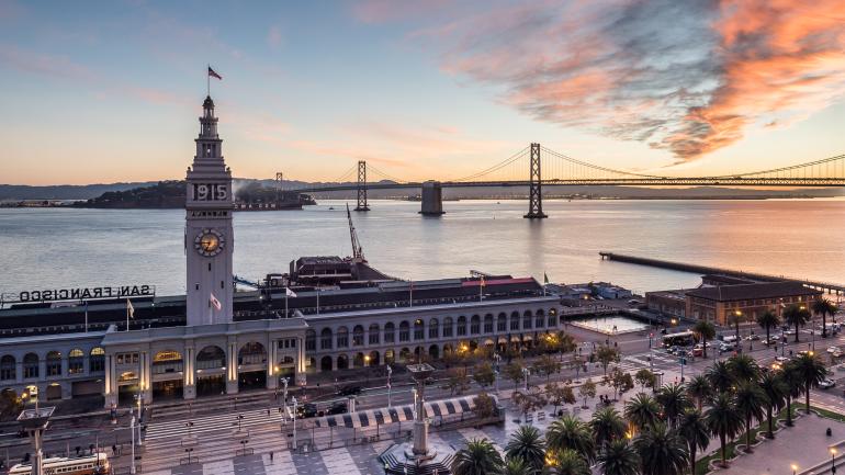 Aerial view of the Ferry Building overlook the Bay Bridge in San Francisco Aerial view of the Ferry Building overlook the Bay Bridge in San Francisco