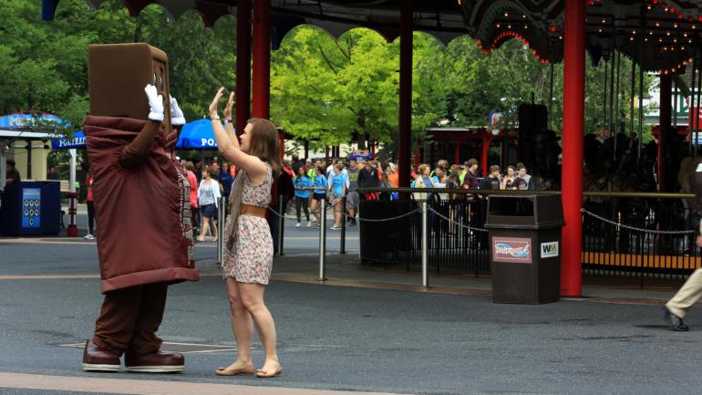 Exchanging high-fives with a sweet character at Hersheypark Exchanging high-fives with a sweet character at Hersheypark