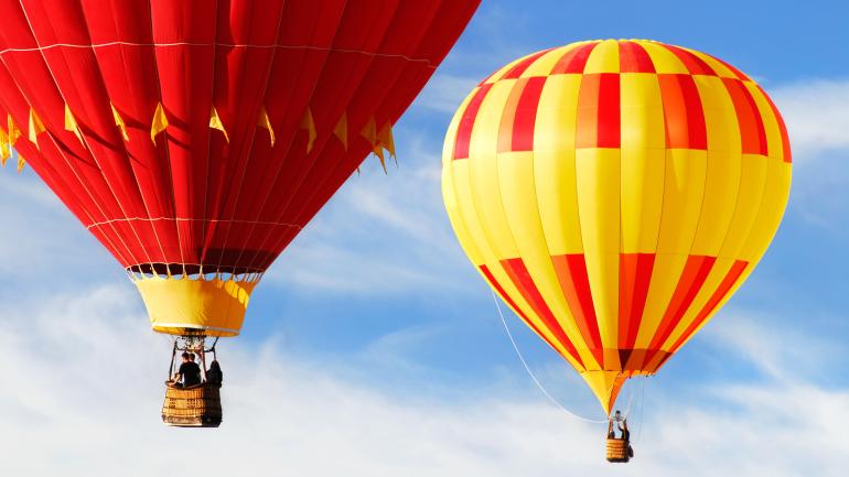 Roar of burners as balloons take off for the morning ascension Roar of burners as balloons take off for the morning ascension