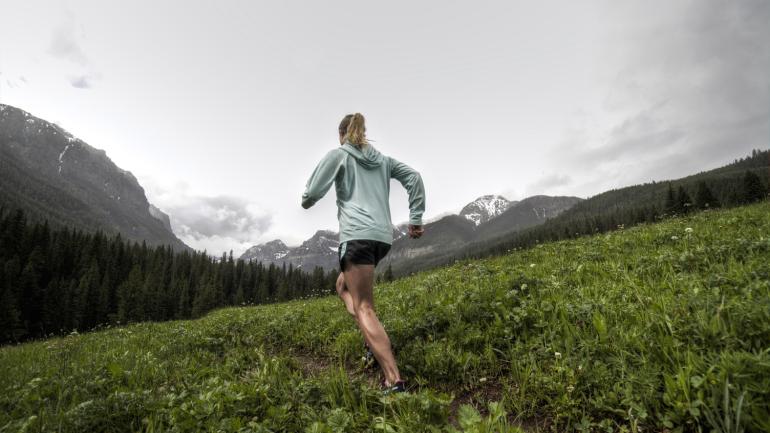 A trail runner in Hyalite Canyon A trail runner in Hyalite Canyon