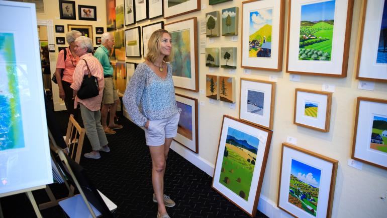 Admiring artwork in Epoch 18 gallery in Woodstock Admiring artwork in Epoch 18 gallery in Woodstock
