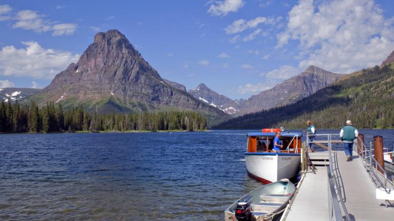 Historic wooden boat tour on Two Medicine Lake at Glacier National Park Historic wooden boat tour on Two Medicine Lake at Glacier National Park