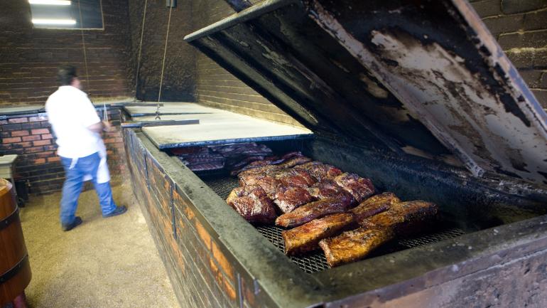 Barbecue being cooked at a smokehouse in Lockhart, Texas Barbecue being cooked at a smokehouse in Lockhart, Texas