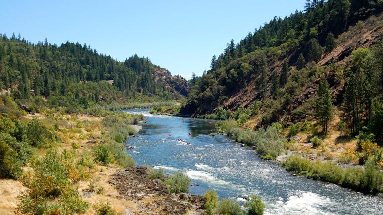 Beginning a kayak trip on the Rogue River through Hellgate Canyon Beginning a kayak trip on the Rogue River through Hellgate Canyon