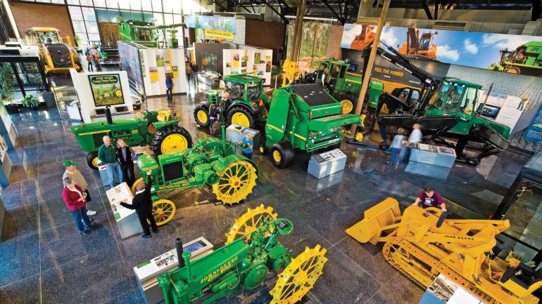 Showcasing farming machinery at the John Deere Pavilion in Moline, Illinois Showcasing farming machinery at the John Deere Pavilion in Moline, Illinois