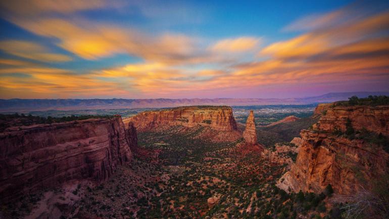 Sunrise over the red rock formations at the Colorado National Monument near Grand Junction Sunrise over the red rock formations at the Colorado National Monument near Grand Junction