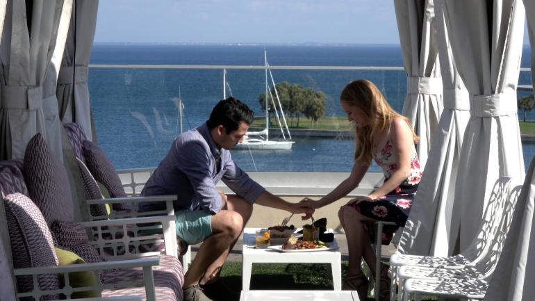 Couple dining with a view from The Canopy at the Birchwood in downtown St. Petersburg, Florida Couple dining with a view from The Canopy at the Birchwood in downtown St. Petersburg, Florida